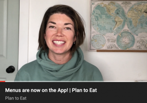 screenshot of video clip with woman in blue sweater