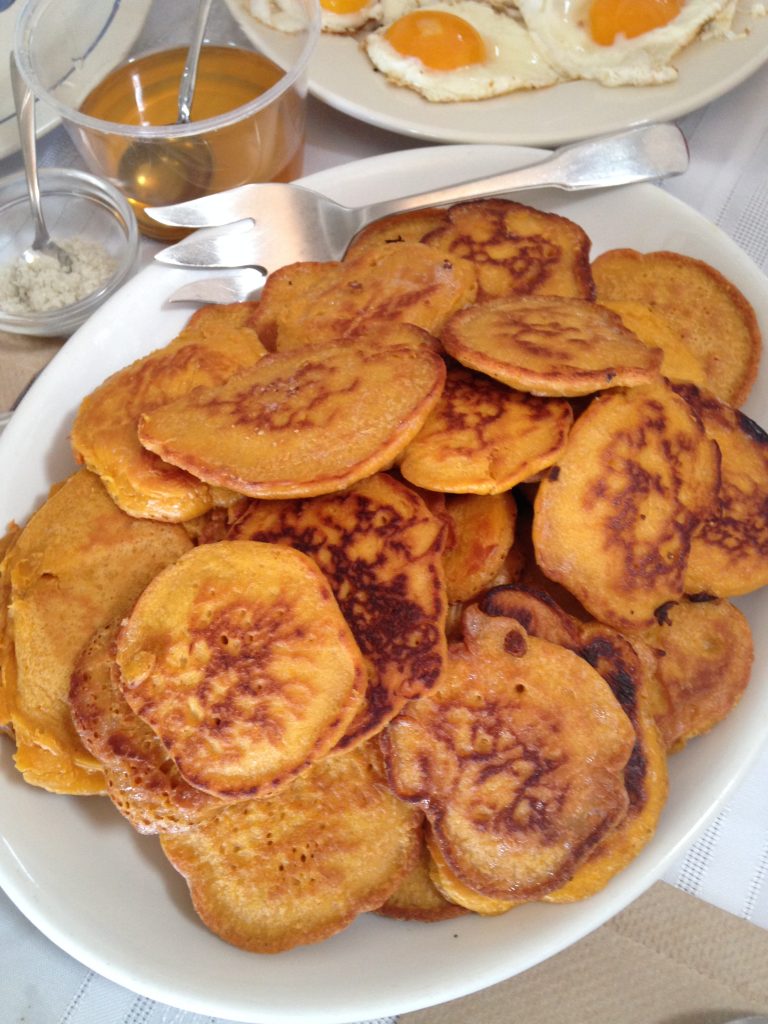 overhead view of a platter of golden pancakes