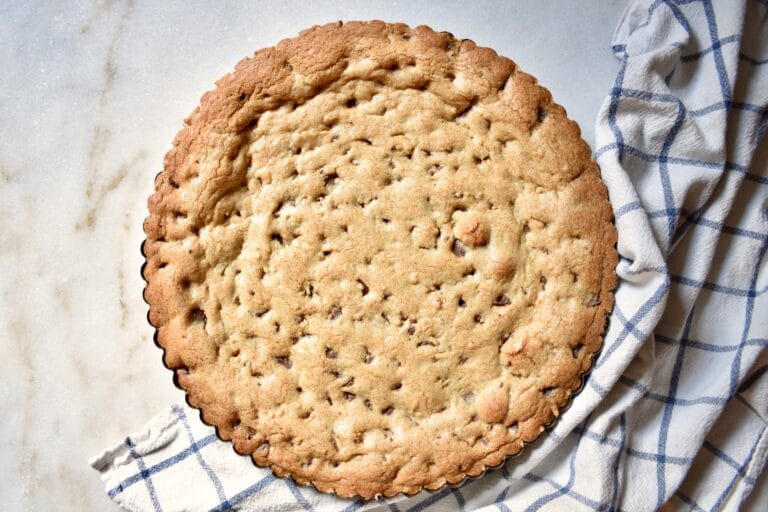 overhead shot of cookie cake in tart pan, after baking finished