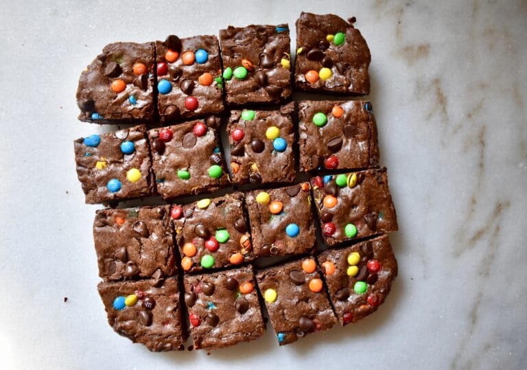 overhead shot of brownies with m&ms, cut into squares