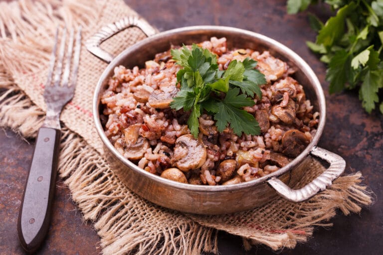 wild rice stuffing in a metal casserole dish