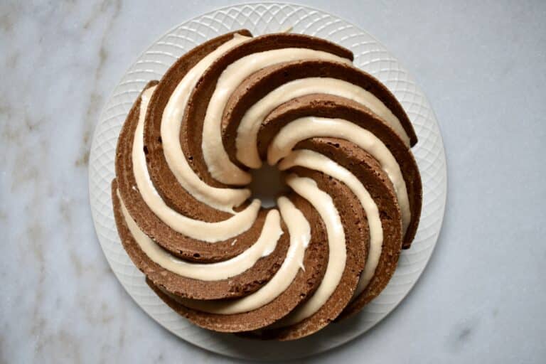 overhead shot of spice bundt cake with frosting